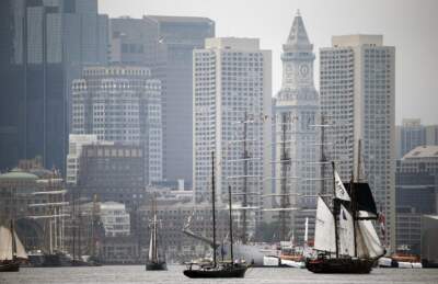 Tall ships pass in front of the skyline during Sail Boston's Parade of Sail, June 17, 2017, in Boston.(Michael Dwyer/AP)