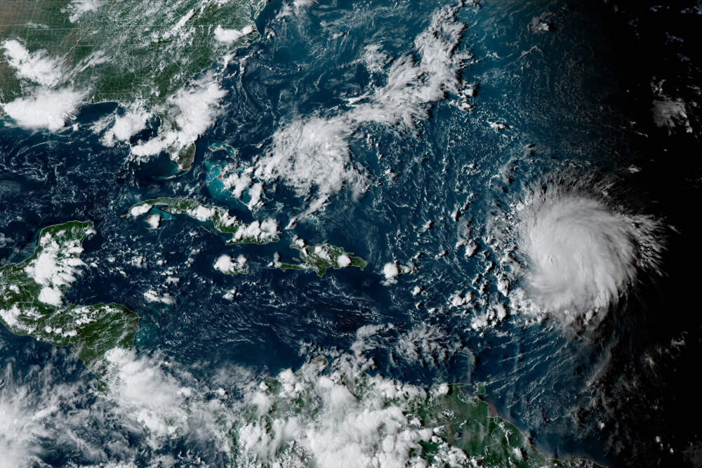 Hurricane Lee, right, in the Atlantic Ocean on Friday, Sept. 8, 2023. (NOAA via AP)