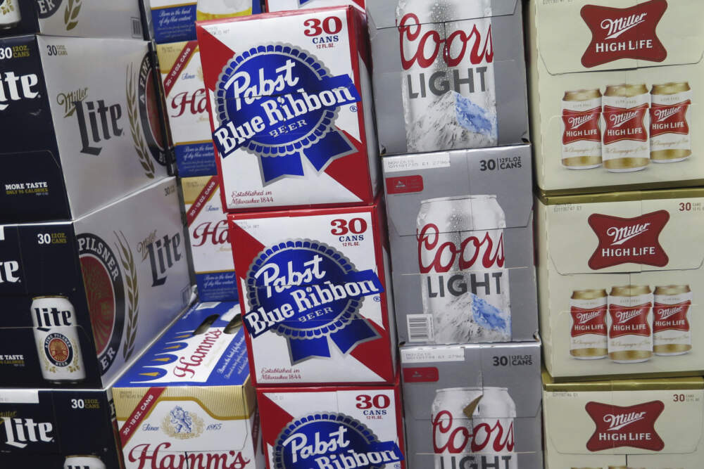 Cases of beer are stacked next to each other in a Milwaukee liquor store. (Ivan Moreno/AP)