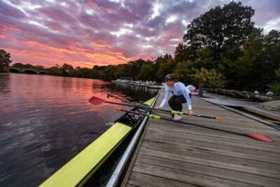 Rower Maria Prodan prepares to set out onto the Charles River to practice in the early morning at Community Rowing in Brighton. (Jesse Costa/WBUR)
