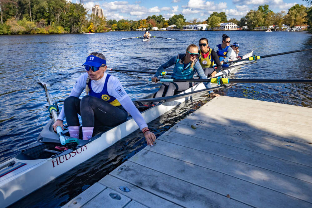 Members of the Ukrainian national rowing team dock after a morning practice on the Charles River. (Jesse Costa/WBUR)