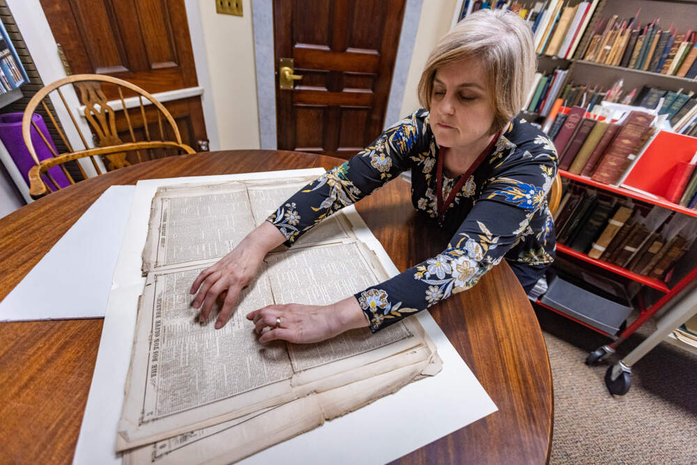 Elizabeth Pope, curator of books and digitized collections at the American Antiquarian Society in Worcester, assisted Max Chapnick’s research that led to this discovery of “The Phantom” by E.H. Gould. Here she points out the location of the work in the original 1860 newspaper The Olive Branch. (Jesse Costa/WBUR)