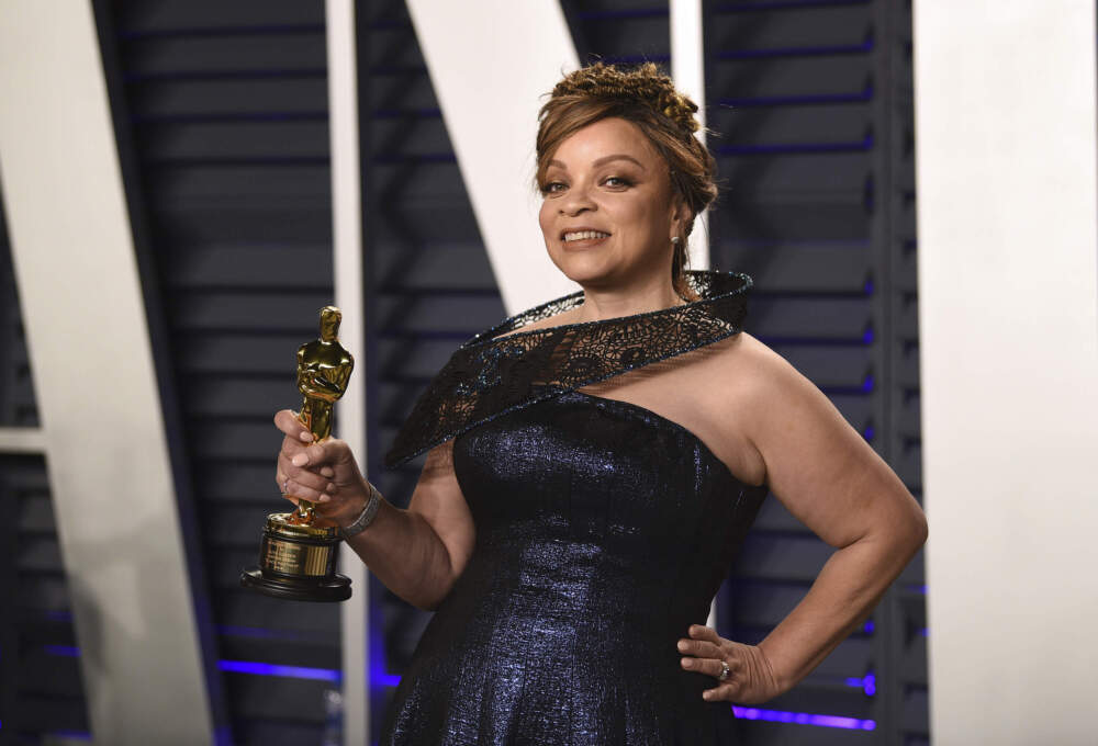 Ruth Carter, winner of the award for best costume design for &quot;Black Panther,&quot; holds up her award. (Evan Agostini/Invision/AP)