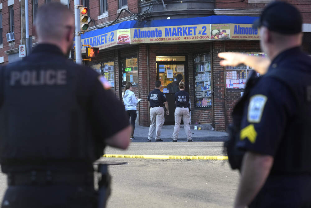 Law enforcement officials investigate the scene where multiple were shot, Wednesday, Oct. 4, 2023, in Holyoke, Mass. (Steven Senne/AP)
