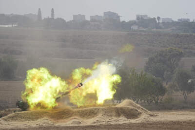 An Israeli howitzer fires at the Gaza Strip from the south of Israel on Thursday, Oct. 12, 2023. (Ohad Zwigenberg/AP)