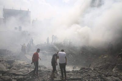 Palestinians look for survivors after an Israeli airstrike in Rafah refugee camp, southern Gaza Strip, Thursday, Oct. 12, 2023. (Hatem Ali/AP)
