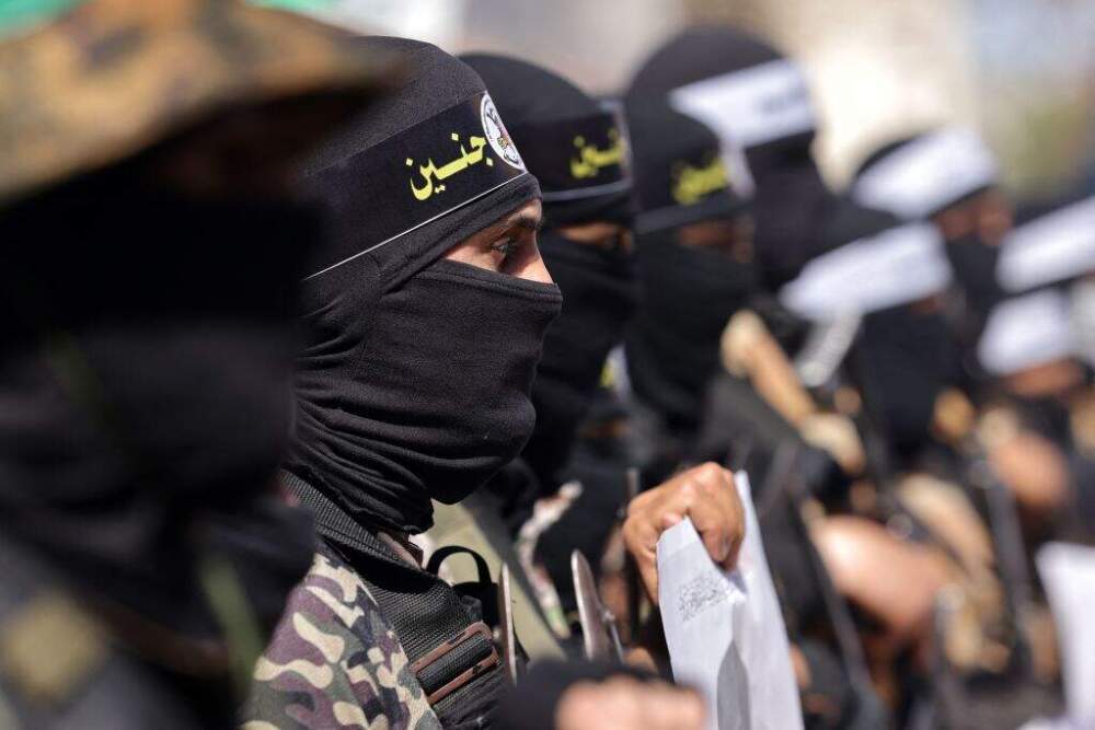 Armed Hamas movement militants. (MOHAMMED ABED/AFP via Getty Images)