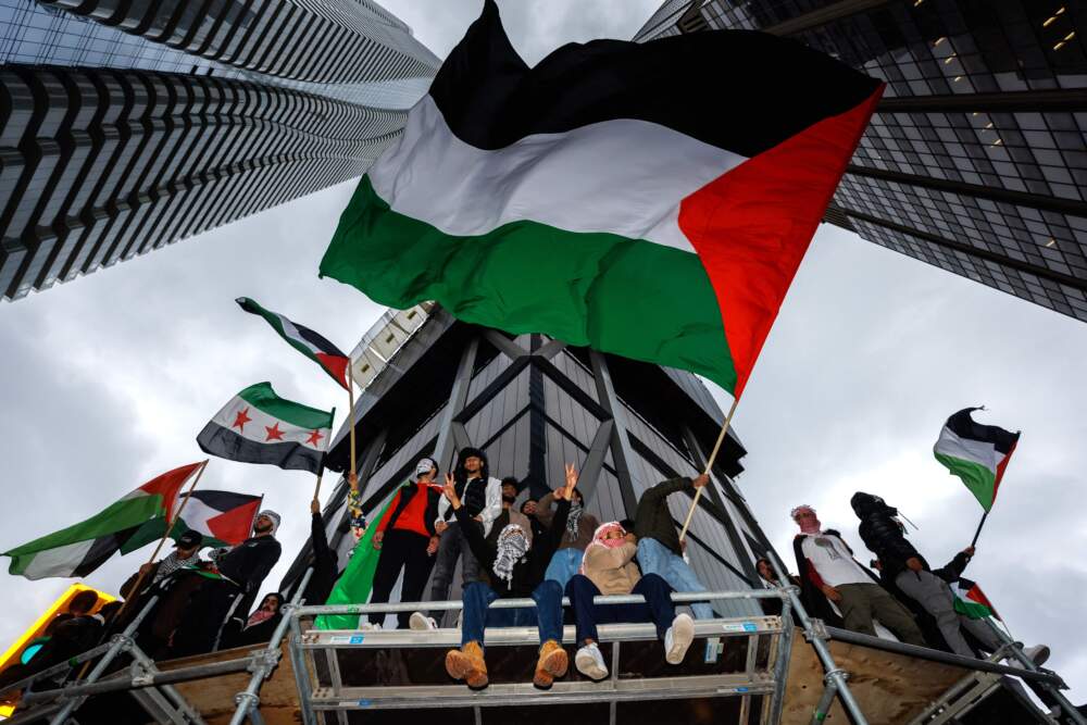Demonstrators in support of Palestinians wave Palestinian flags during a protest in Toronto, Ontario, Canada, on Oct. 9, 2023. (Cole Burston/AFP via Getty Images)