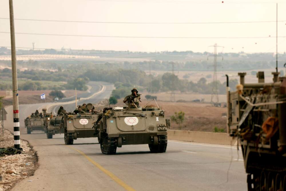 Israeli soliders ride in their armoured vehicles towards the border with the Gaza Strip on Oct. 16, 2023, amid the ongoing battles between Israel and the Palestinian group Hamas. (Menahem Kahana/AFP via Getty Images)