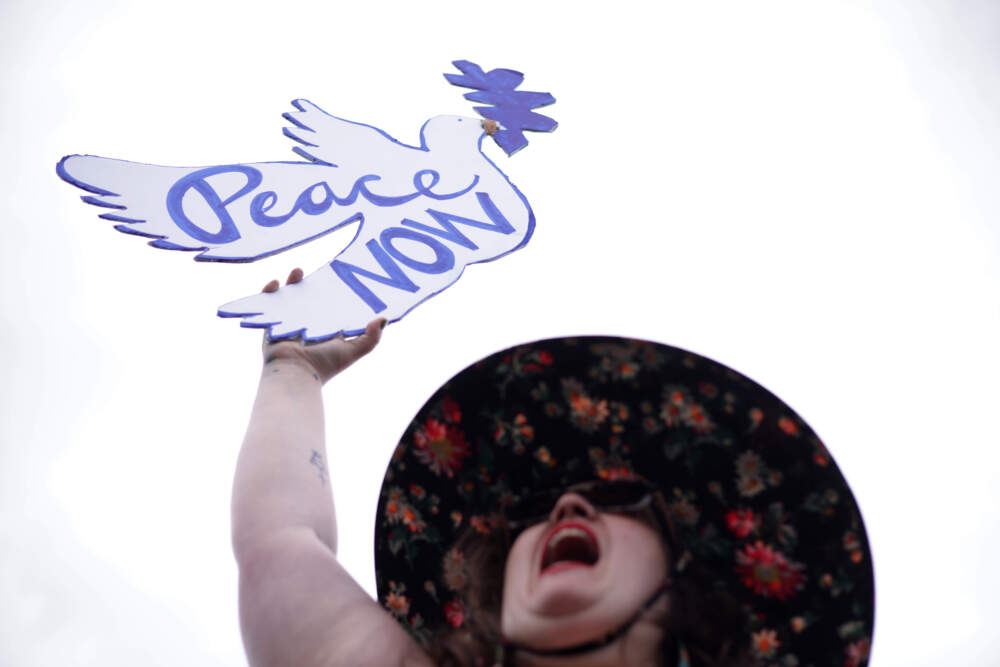A protester holds up a sign that reads &quot;Peace NOW&quot; during a demonstration in support of a cease fire against the Palestinians in Gaza at the National Mall on October 18, 2023 in Washington, DC. Members of the Jewish Voice for Peace and the IfNotNow movement staged a rally to call for a cease fire in the Israel–Hamas war. (Alex Wong/Getty Images)