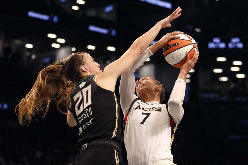Alysha Clark #7 of the Las Vegas Aces drives to the basket against Sabrina Ionescu #20 of the New York Liberty in the fourth quarter during Game Four of the 2023 WNBA Finals at Barclays Center on Oct. 18, 2023 in New York City. (Sarah Stier/Getty Images)