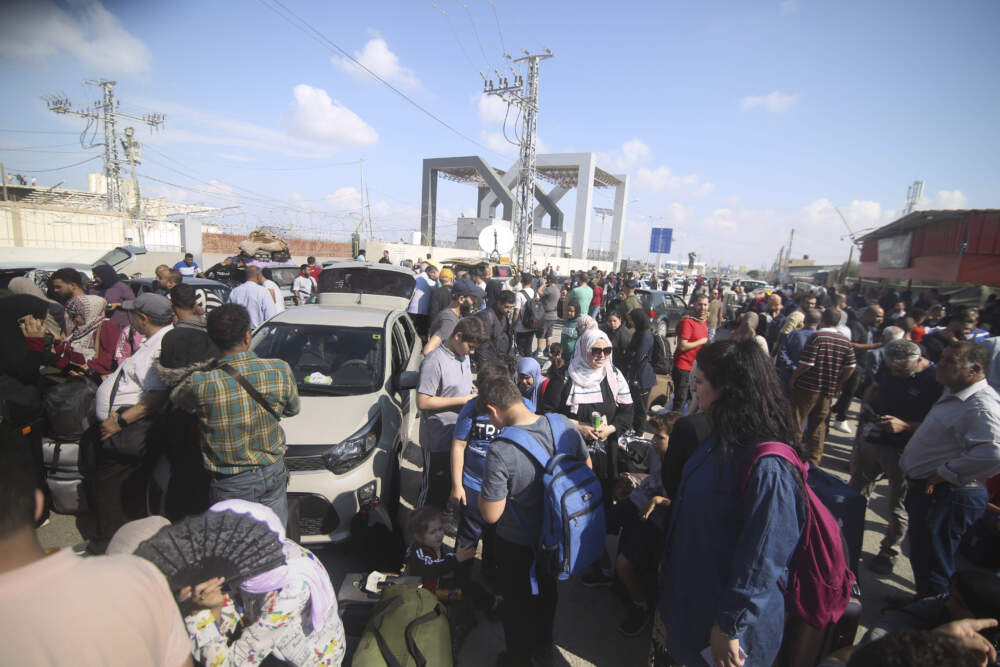 Palestinians wait to cross to the Egyptian side at Rafah border on the Gaza Strip on Oct. 16. (Hatem Ali/AP)