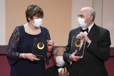 Japan Prize 2022 laureates Hungarian-American biochemist Katalin Kariko, left, and American physician-scientist Drew Weissman, right, pose with their trophies during the Japan Prize presentation ceremony Wednesday, April 13, 2022, in Tokyo. Karikó and Weissman won the Nobel Prize in medicine for enabling development of mRNA COVID-19 vaccines, the organization announced Monday. (Eugene Hoshiko/AP Pool)