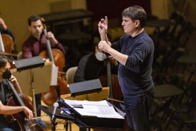 Keith Lockhart conducts the Boston Pops during a rehearsal for the Holiday Pops concerts at Symphony Hall. (Jesse Costa/WBUR)