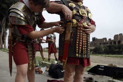 Ancient Roman enthusiasts wearing Centurion costumes get dresses at the Circus Maximus prior to the start of a parade to celebrate the festivities of Christmas of Rome, Monday, April 22, 2019.