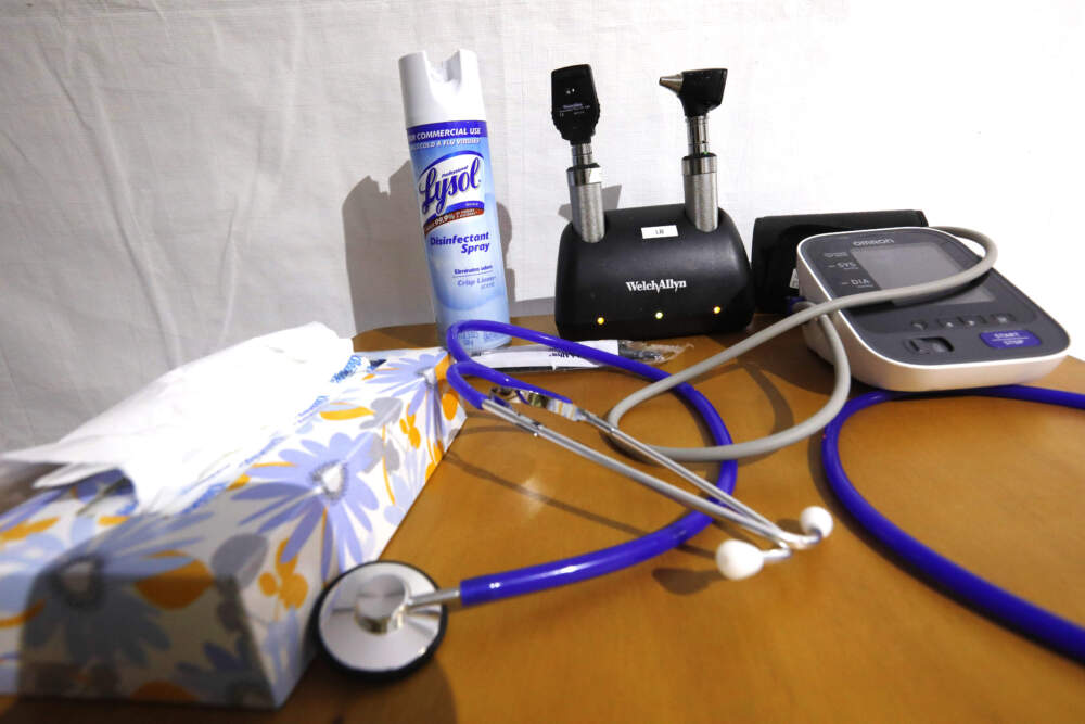 A stethoscopes and blood pressure monitor on set on a rolling rolling table. (Rogelio V. Solis/AP)