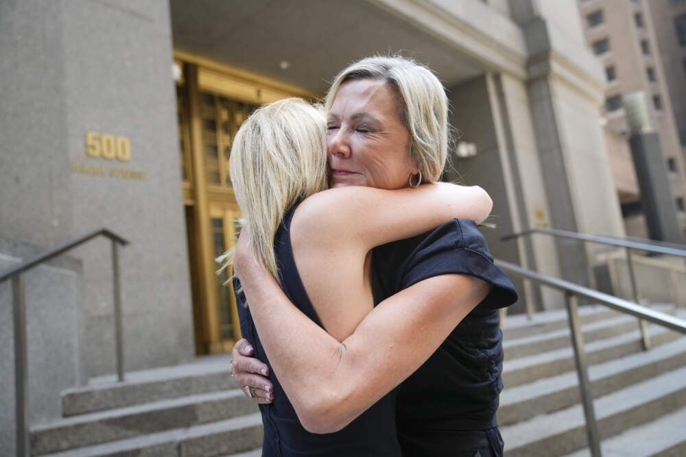 Sexual assault survivors Amy Yoney, right, and Laurie Kanyok, left, embrace after speaking to members of the media during a break in sentencing proceedings for convicted sex offender Robert Hadden outside Federal Court in New York. The former obstetrician was convicted of sexually abusing multiple patients over several decades. (John Minchillo/AP)