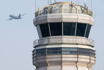 An American Airlines Airbus A319 airplane takes off past the air traffic control tower at Ronald Reagan Washington National Airport in Arlington, Virginia, January 11, 2023 (SAUL LOEB/AFP via Getty Images)