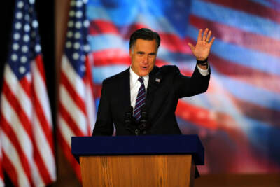 Former Republican presidential candidate, Mitt Romney, waves to the crowd while speaking at the podium as he concedes the presidency during Mitt Romney's campaign election night event at the Boston Convention &amp; Exhibition Center on November 7, 2012 in Boston, Massachusetts. (Joe Raedle/Getty Images)