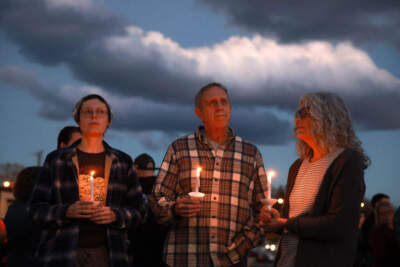 People attend a candlelight vigil to honor the victims of the Lewiston shootings on October 28, 2023 in Lisbon, Maine. (Joe Raedle/Getty Images)