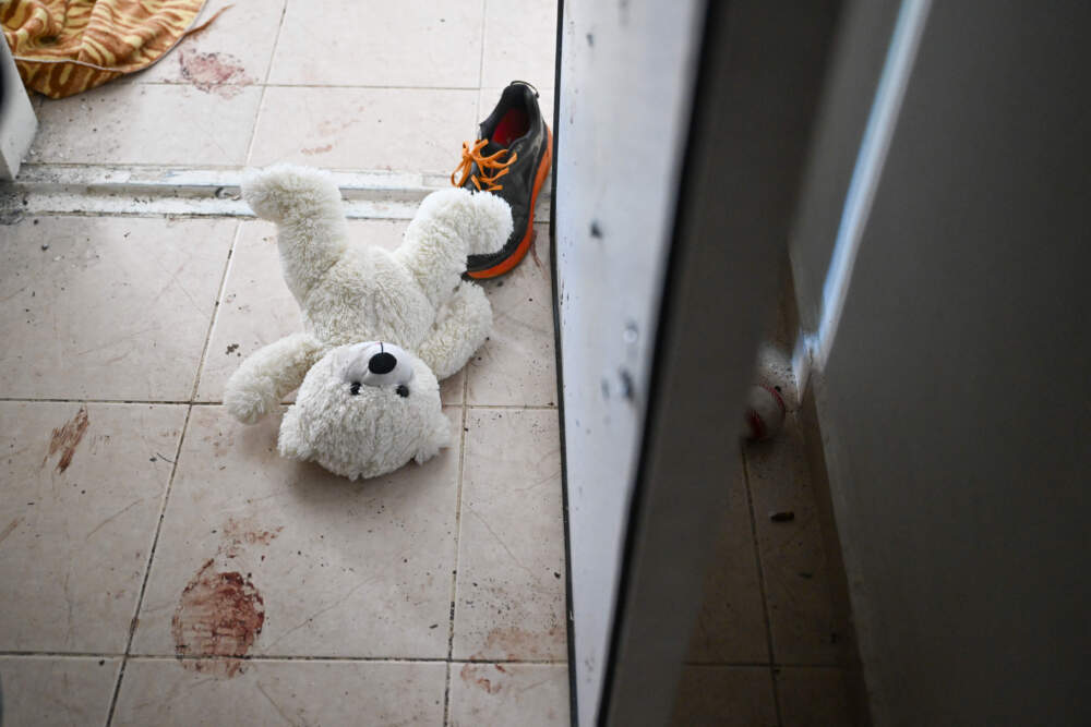 A teddy bear is seen left on the ground near the bomb shelter of a kibbutz home attacked by Hamas on Oct. 7, near the border with Gaza, on Nov. 01, 2023 in Holit, Israel. (Alexi J. Rosenfeld/Getty Images)