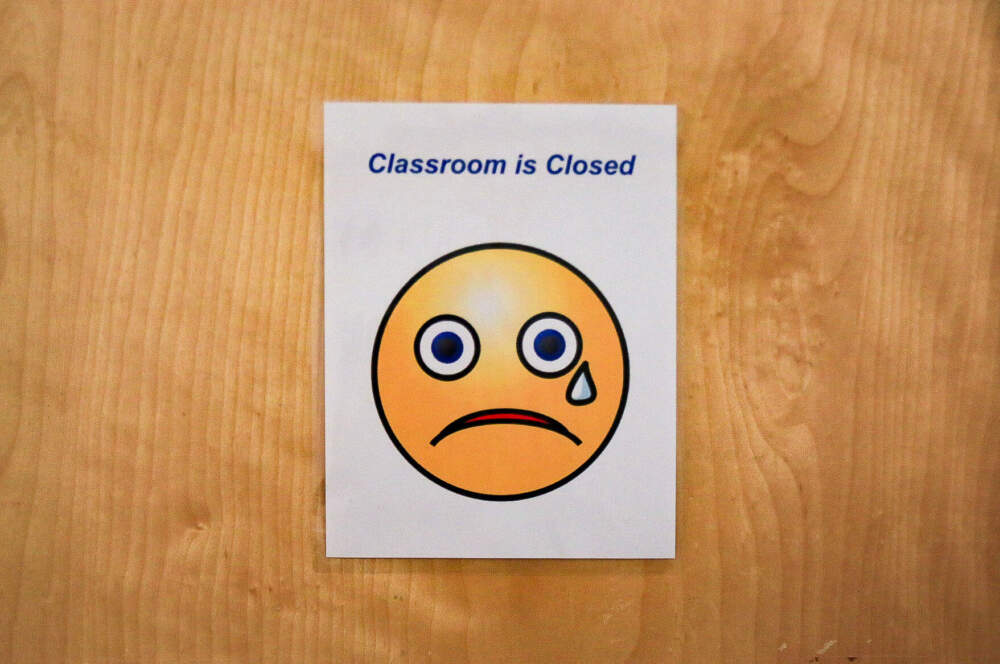A sign on a classroom closed at ABCD East Boston. (Emily Piper-Vallillo/WBUR)
