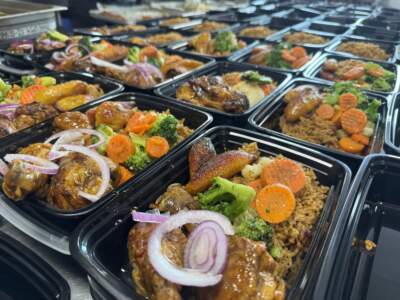 Rows of Creole food prepared by Gourmet Kreyol at Commonwealth Kitchen's Dorchester location. (Courtesy of Nathalie Lecorps/Gourmet Kreyol)