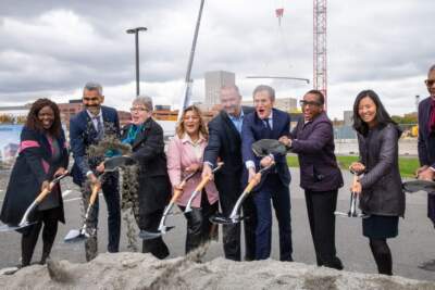Boston Mayor Michelle Wu (second from right) joined several others in symbolically breaking ground at a mixed-use development in Allston (Samuele Petruccelli/WBUR)