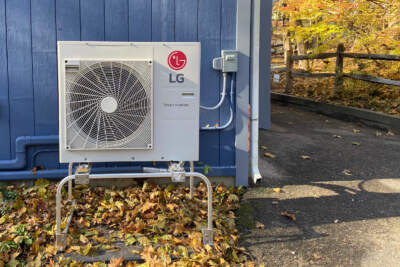 An electric heat pump outside of a building in Massachusetts.