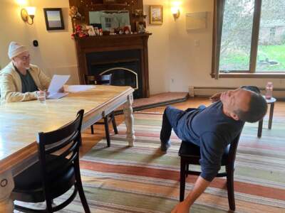 Actor Jay Sefton rehearses the play &quot;Unreconciled&quot; in his dining room. (Nancy Eve Cohen/NEPM)