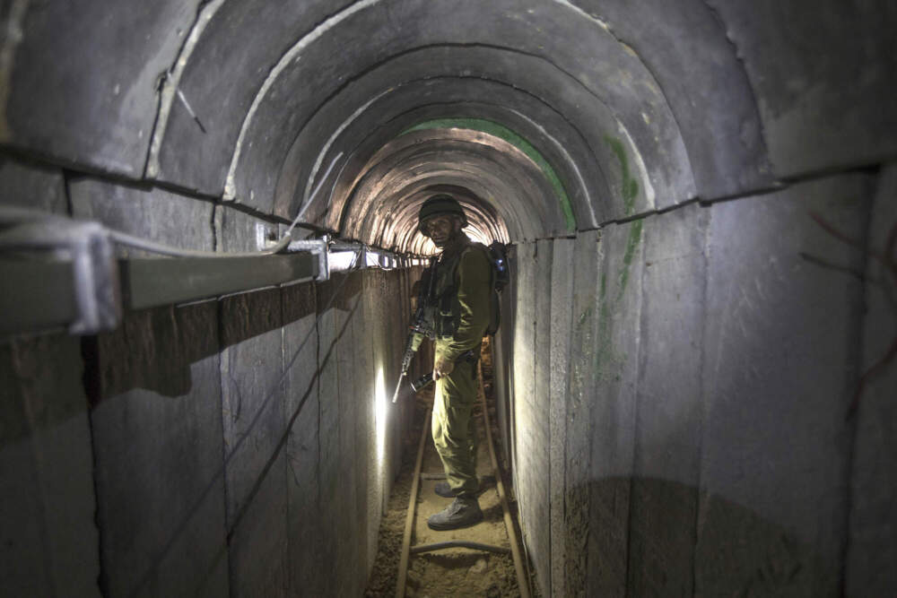 An Israeli army officer gives journalists a tour of a tunnel allegedly used by Palestinian militants for cross-border attacks. (Jack Guez/AP)