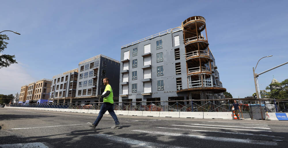 A 140-unit development under construction in 2019 in the Newtonville neighborhood of Newton. The city recently passed scaled-back zoning changes to comply with the state's MBTA Communities Act. (Pat Greenhouse/The Boston Globe via Getty Images)