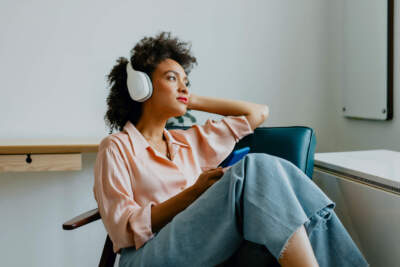 A woman wearing headphones. (Getty Images) 