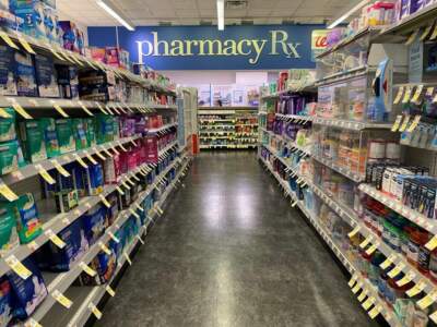 Merchandise aisle and Pharmacy Sign at Walgreens, Queens, New York. (Photo by: Lindsey Nicholson/UCG/Universal Images Group via Getty Images)