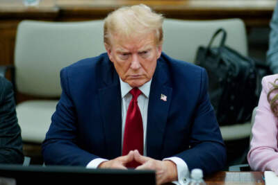 Former U.S. President Donald Trump sits at the defense table while waiting for proceedings to begin in his civil business fraud trial in New York State Supreme Court on December 7, 2023 in New York City. Trump's civil fraud trial alleges that he and his two sons Donald Trump Jr. and Eric Trump conspired to inflate his net worth on financial statements provided to banks and insurers to secure loans. New York Attorney General Letitia James has sued seeking $250 million in damages.  (Photo by Eduardo Munoz Alvarez-Pool/Getty Images)