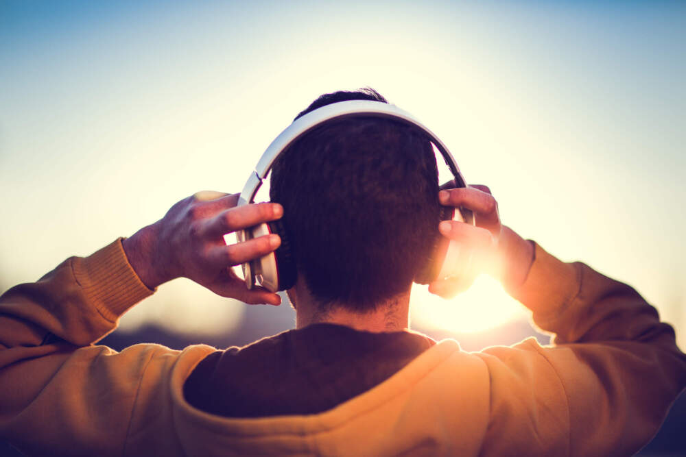 A person listens to music with headphones. (Getty Images)