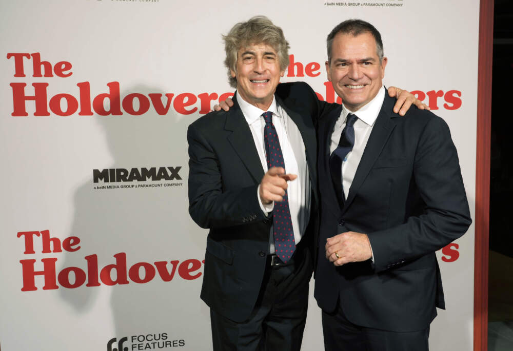 Alexander Payne, left, director of &quot;The Holdovers,&quot; poses with the film's writer David Hemingson at a Los Angeles screening of the film. (Chris Pizzello/AP)
