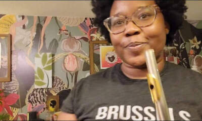 The author in a screen grab from a video she took of herself playing the flute. (Courtesy Theresa Okokon)