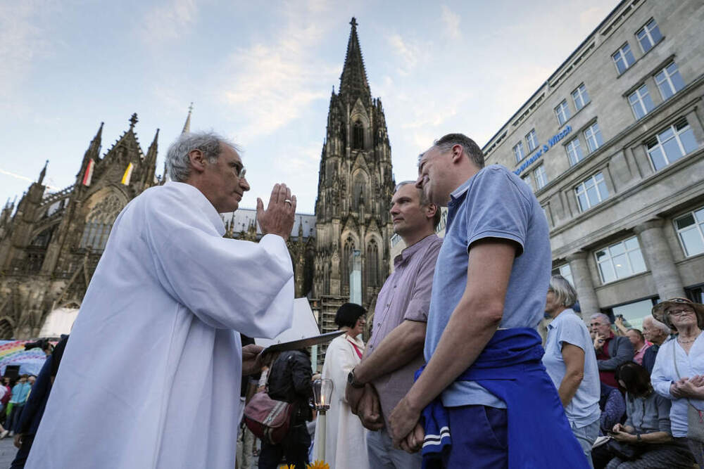 Same-sex couples take part in a public blessing ceremony in front of the Cologne Cathedral in Cologne, Germany, on Sept. 20, 2023. (Martin Meissner/AP)