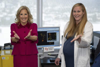 First lady Jill Biden, left, and Dr. Sarah Parker, associate professor, welcome a question from U.S. Secretary Xavier Becerra during a tour of the Van Eyk Lab at Cedars-Sinai Medical Center in Los Angeles, Dec. 8, 2023. Biden was touring the research labs at the Barbara Streisand Women's Heart Center as part of the new White House Women's Health Initiative. (David Crane/The Orange County Register via AP, Pool)