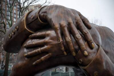 Dr. Martin Luther Kings hands, depicted in the Embrace sculpture on Boston Common. (Robin Lubbock/WBUR)