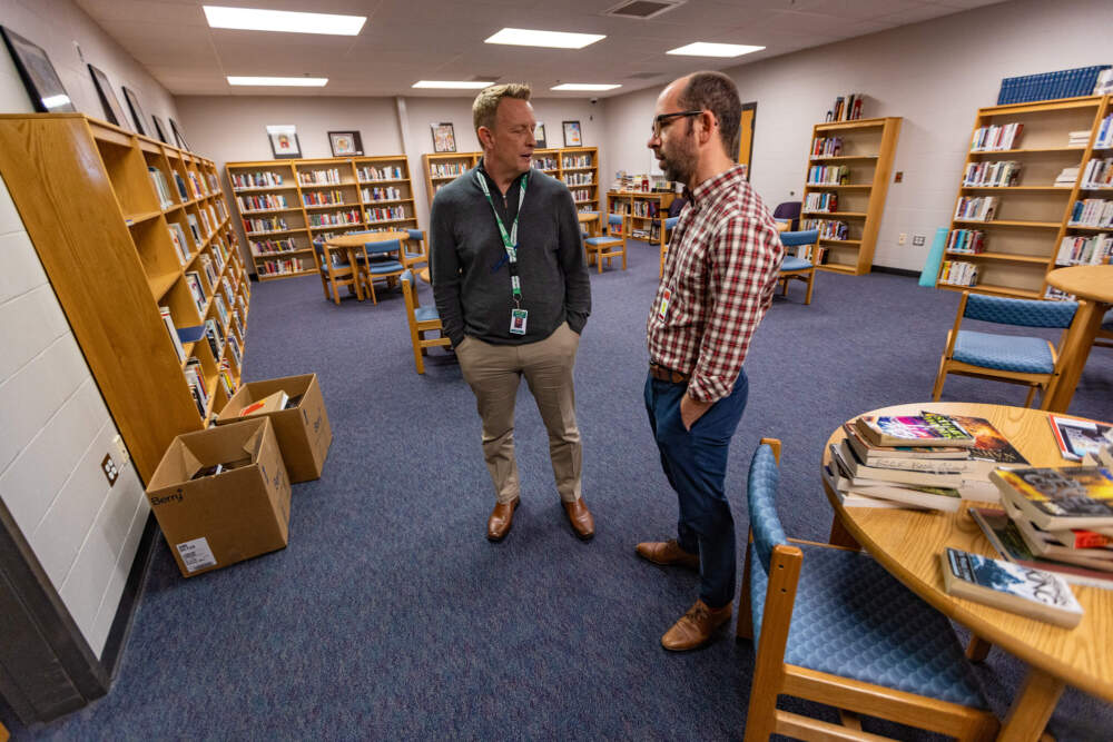 Greg Carbone and Brian Stokes in the library room at Barnstable County Correctional Facility. (Jesse Costa/WBUR)