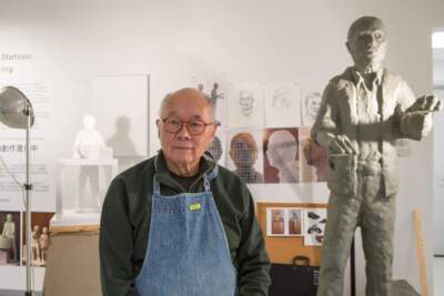Wen-ti Tsen, 88, is undertaking the task of transforming clay models of a laundryman, a garment worker, a restaurant worker and a caretaker into bronze statues that will be installed throughout Chinatown. (Jacob Garcia/WBUR)