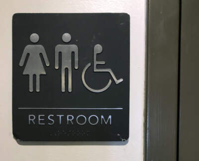 A sign is posted on a restroom door for general use by all patrons. (Bill Sikes/AP)