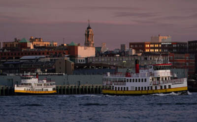 City Hall towers over surrounding buildings as the Casco Bay Lines ferry Wabanaki travels out of the harbor, Wednesday morning, June 1, 2022, in Portland, Maine. (Robert F. Bukaty/AP)