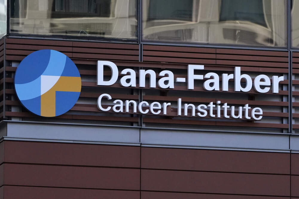 A sign hangs from the Dana-Farber Cancer. (Charles Krupa/AP)