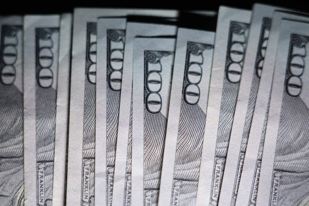U.S. $100 bills are seen. (Matt Slocum/AP)
