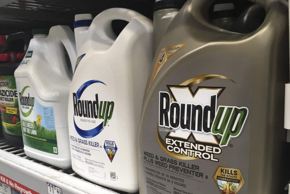 Containers of Roundup sit on a store shelf. (Haven Daley/AP)