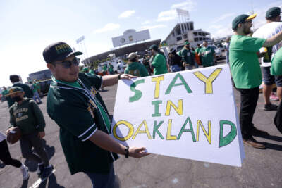 Reuben Ortiz of Modesto, Calif., holds a sign outside Oakland Coliseum to protest the Oakland Athletics' planned move to Las Vegas, before a baseball game between the Athletics and the Tampa Bay Rays in Oakland, Calif., June 13, 2023. The Athletics’ move to Las Vegas was unanimously approved Thursday, Nov 16, 2023 by Major League Baseball team owners. After years of complaints about the Oakland Coliseum and an inability to gain government assistance for a new ballpark in the Bay area, the A’s plan to move to a stadium to be built on the Las Vegas Strip with $380 million in public financing approved by the Nevada government. (Jed Jacobsohn/AP)