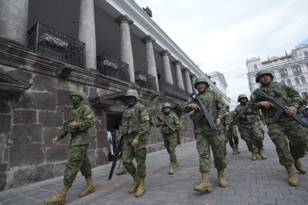 Soldiers patrol outside the government palace during a state of emergency in Quito, Ecuador. (Dolores Ochoa/AP)